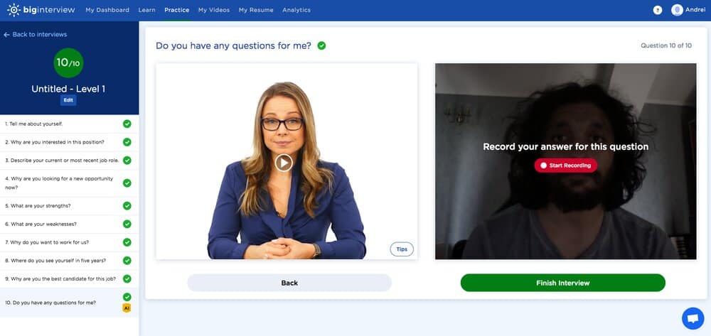 This is a photo of one of Big Interview's Mock Interview Simulator's interviewer. She is a blonde woman, dressed professionally, who wears glasses.
